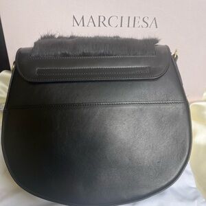 Marchesa black fur purse.